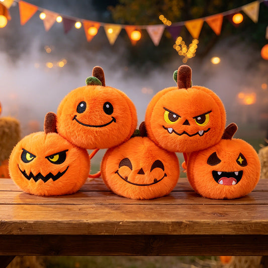Set of five orange plush pumpkin keychains with embroidered faces