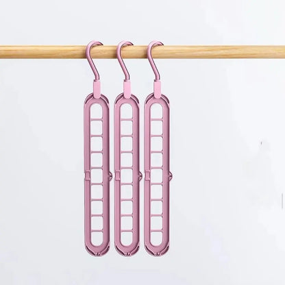 Closet organizer hanger holding folded trousers