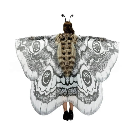 Moth wing cape worn as a festival wrap