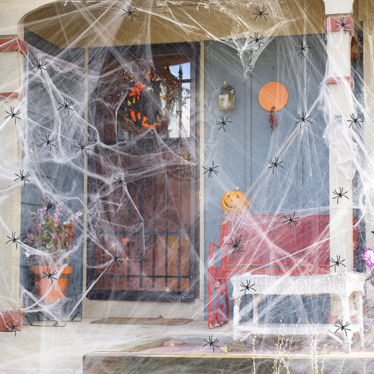 Stretchable faux spider web with detachable mini spiders