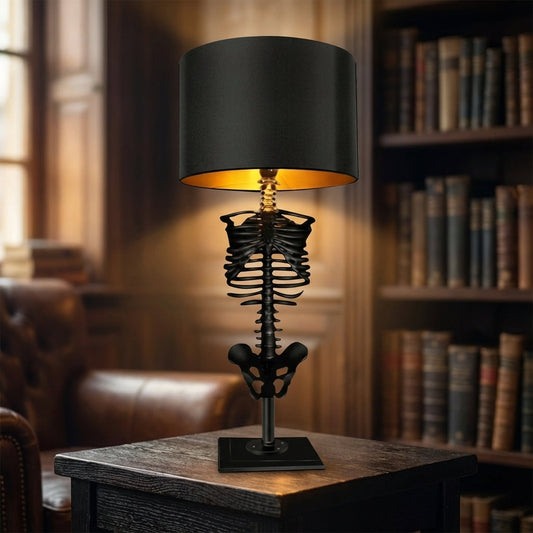 Black resin skeleton desk lamp with warm glow shade